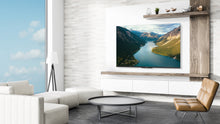 Load image into Gallery viewer, The new Skyworth UE7600 series is designed to look great On and Off. Its ultra-slim bezel-less frame virtually eliminates the bulk, revealing a picture that virtually floats in space. Wall mounted or resting on stand legs, the screen size offerings range from 43&quot; to 75&quot;.
